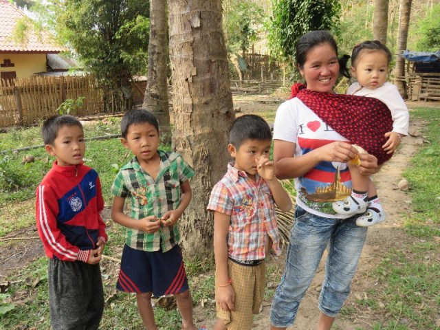 Female teak grower and family at Ban Densavang.